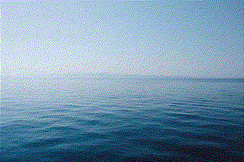 A dithered image of a photo taken out in an ocean in the morning with small waves and a blue and pink sky, it has a grainy appearance similar to the feeling of sandpaper